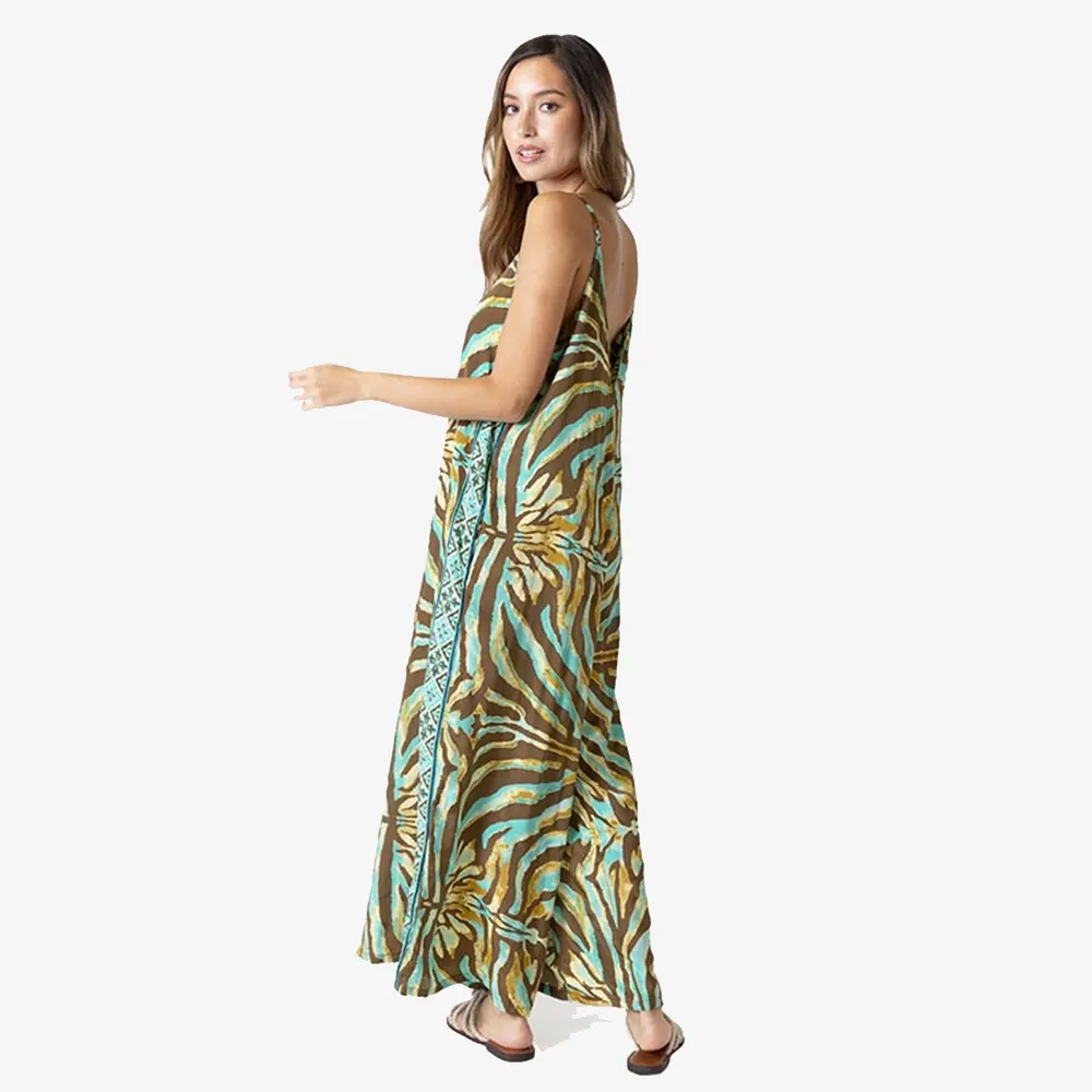 tantrend "Boho Soul" Ολόσωμη Φόρμα Zebra 3 Πλαϊνή όψη από ολόσωμη φόρμα καμπάνα Tantrend σε βεραμάν καφέ με τσέπες και διακοσμητική τιρκουάζ φάσα